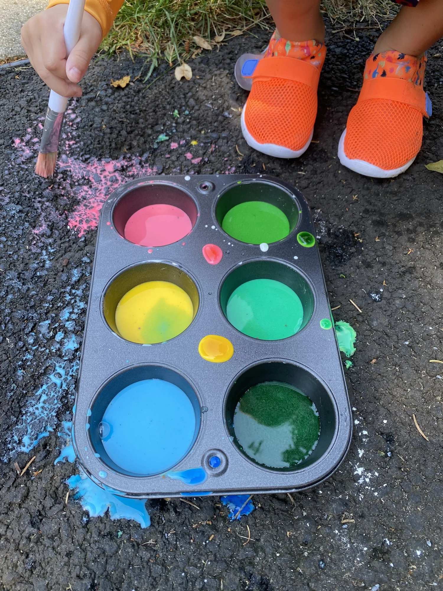 Child exploring sensory art materials
